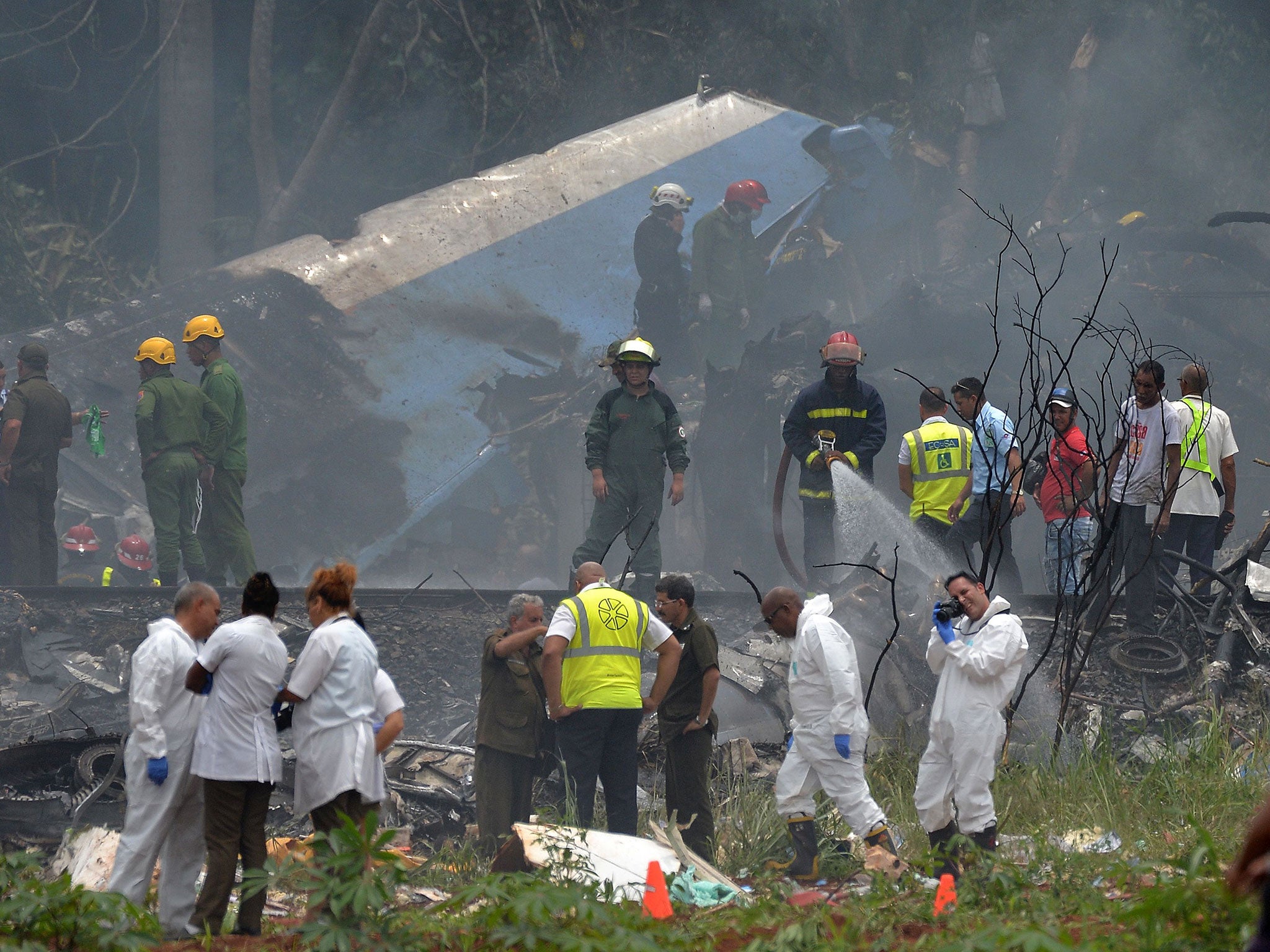 Emergency personnel at the site of the accident near Havana’s Jose Marti airport