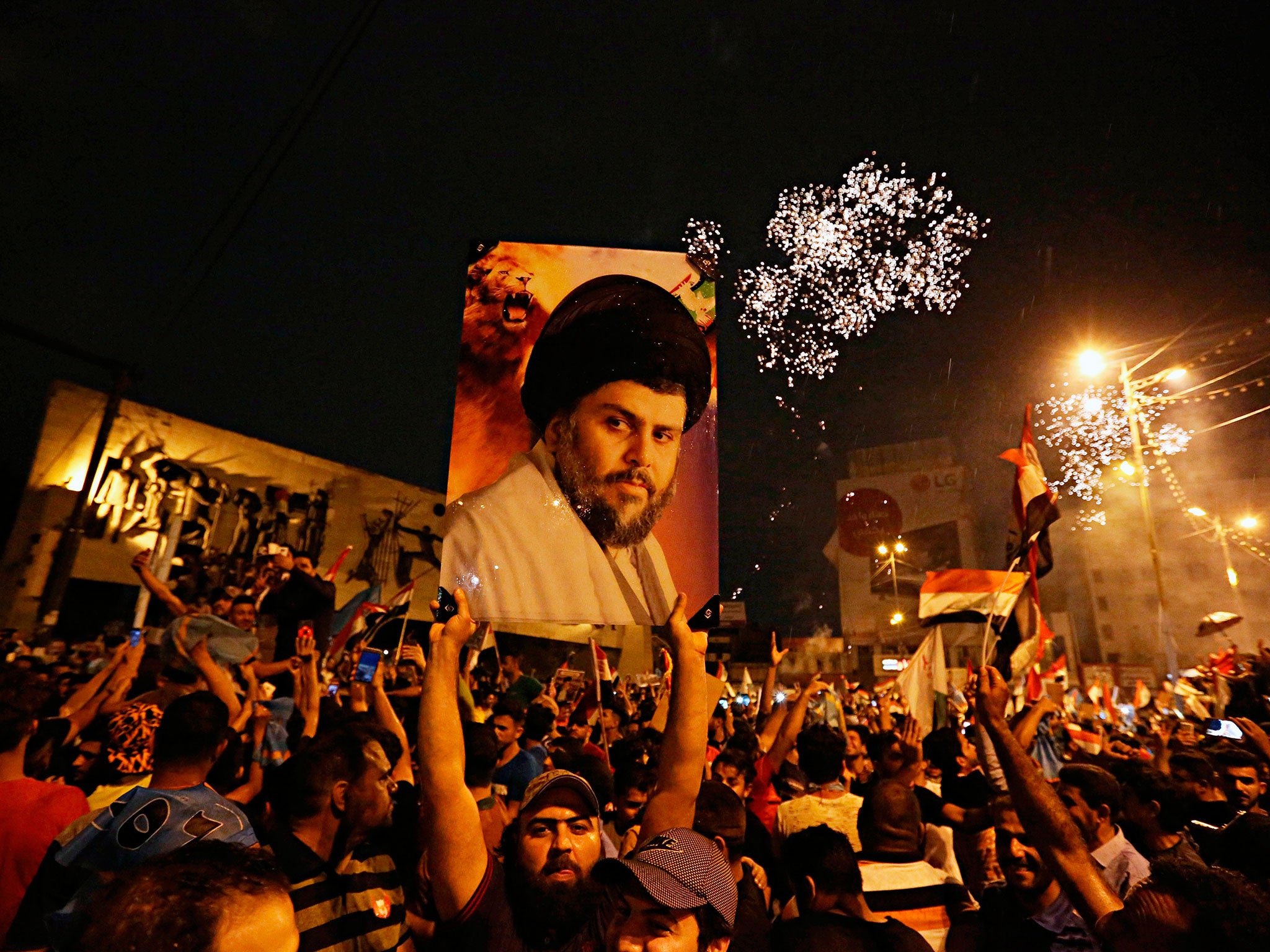 Followers of Shia cleric Muqtada al-Sadr celebrate in Tahrir Square, Baghdad