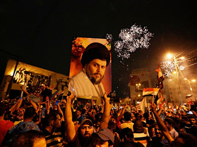 Followers of Shia cleric Muqtada al-Sadr celebrate in Tahrir Square, Baghdad