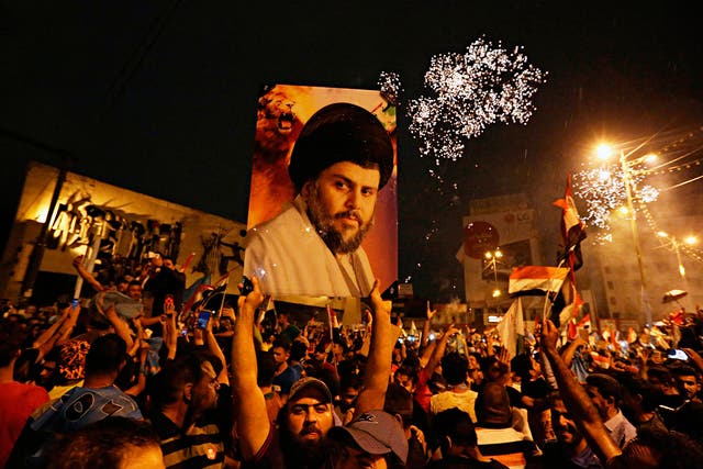 Followers of Shia cleric Muqtada al-Sadr celebrate in Tahrir Square, Baghdad