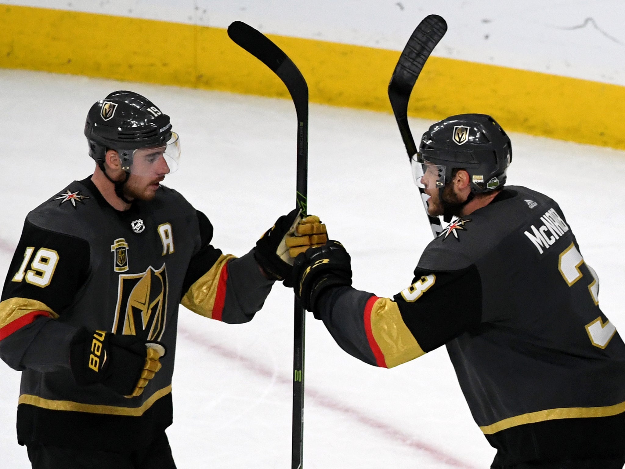 Reilly Smith consults with team-mate Brayden McNabb (Getty )