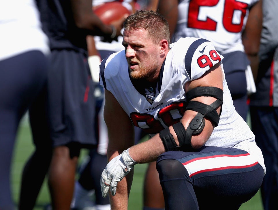 JJ Watt kneels before a game against the New England Patriots