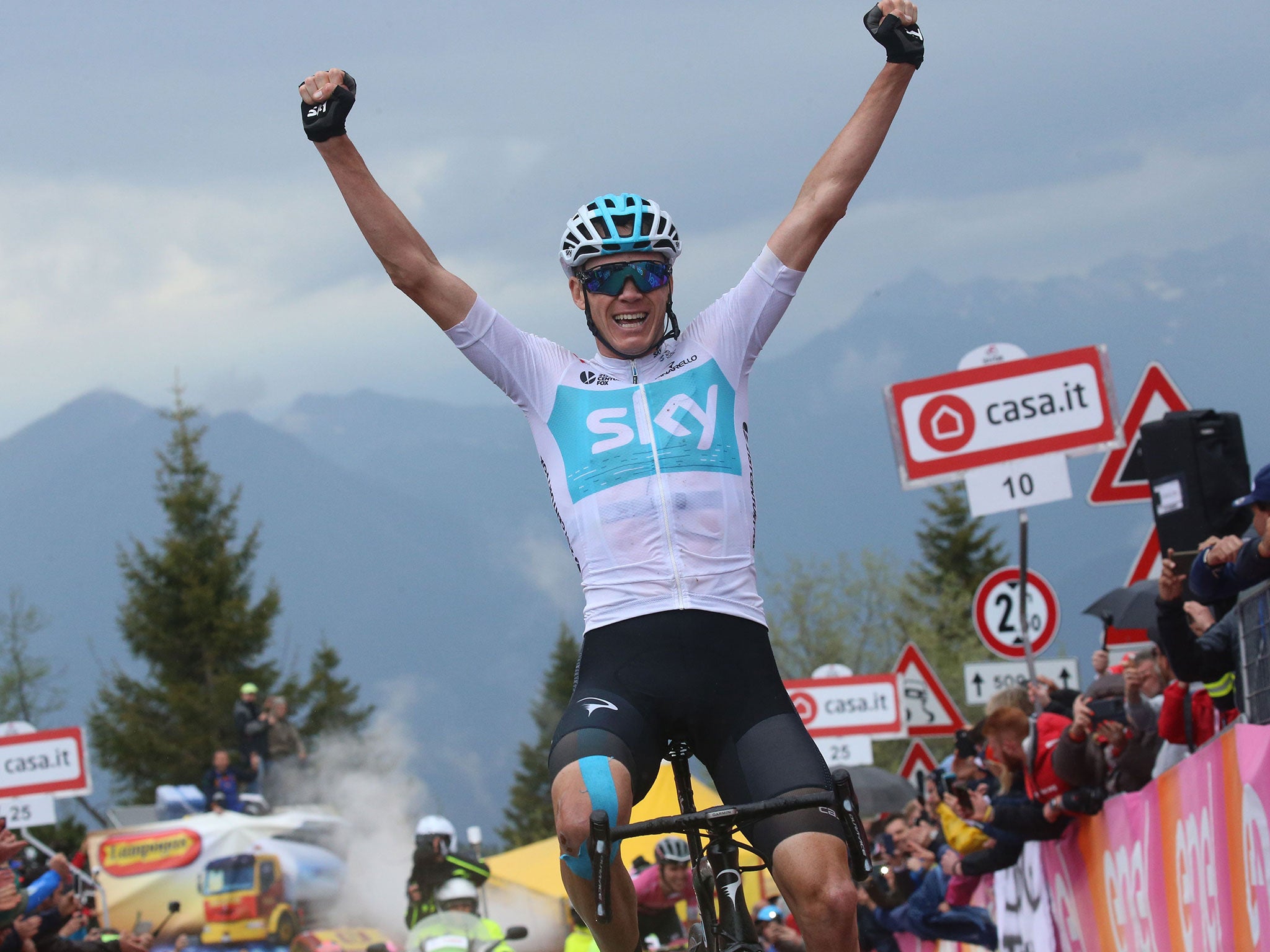 Chris Froome celebrates as he crosses the line in first place