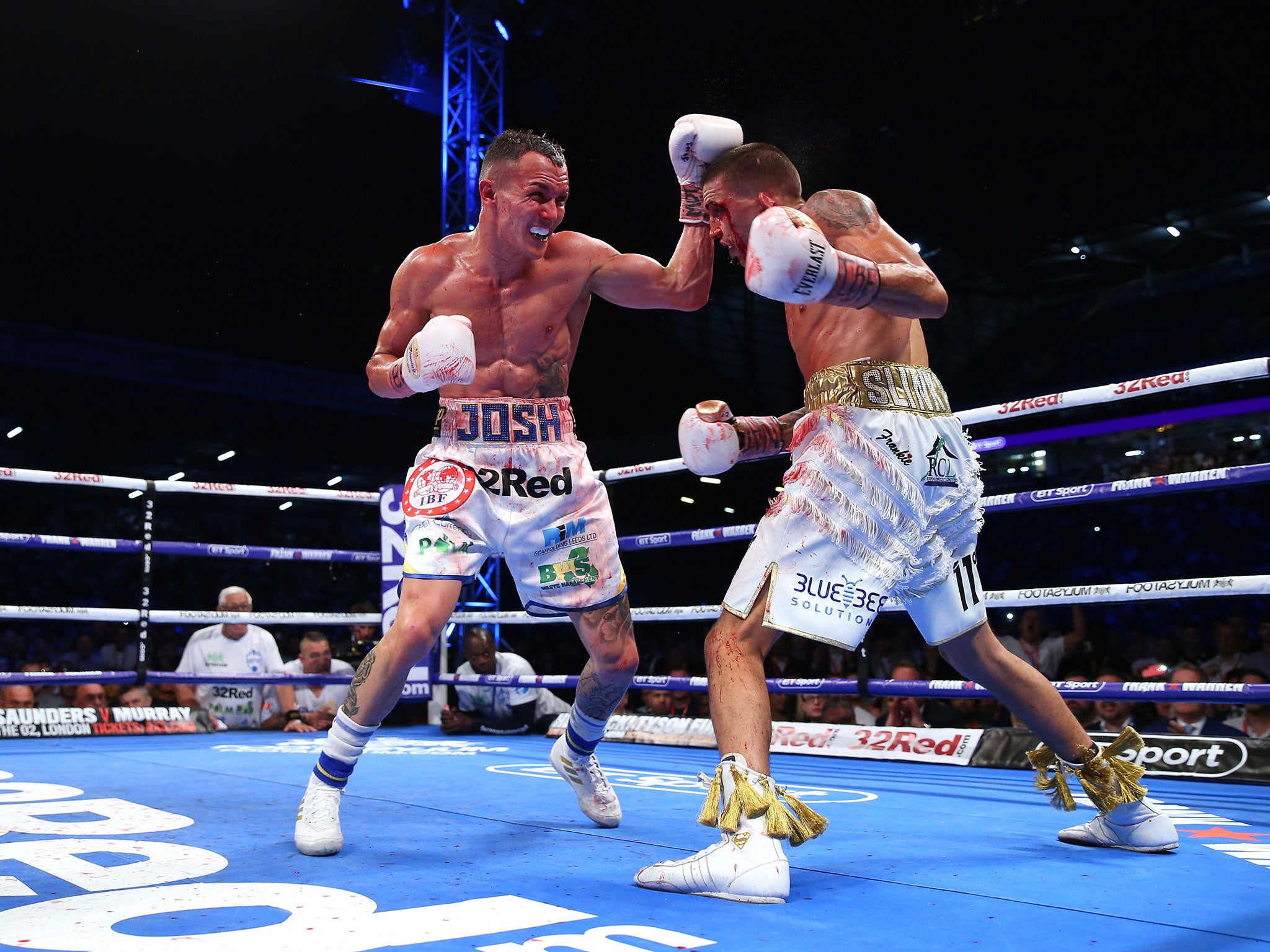 Josh Warrington lands a left shot against Lee Selby