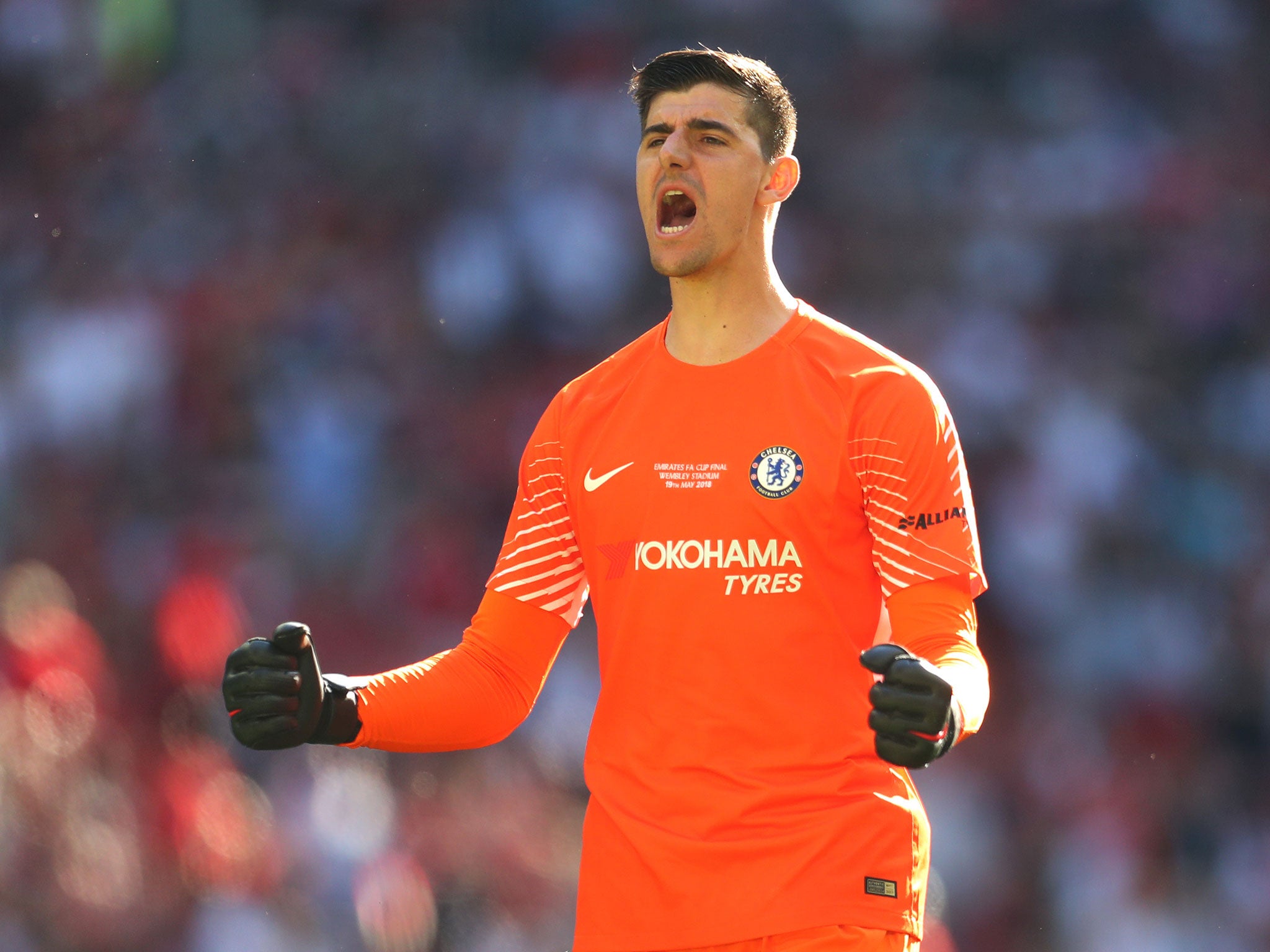 Thibaut Courtois celebrates after securing the FA Cup with Chelsea on Saturday