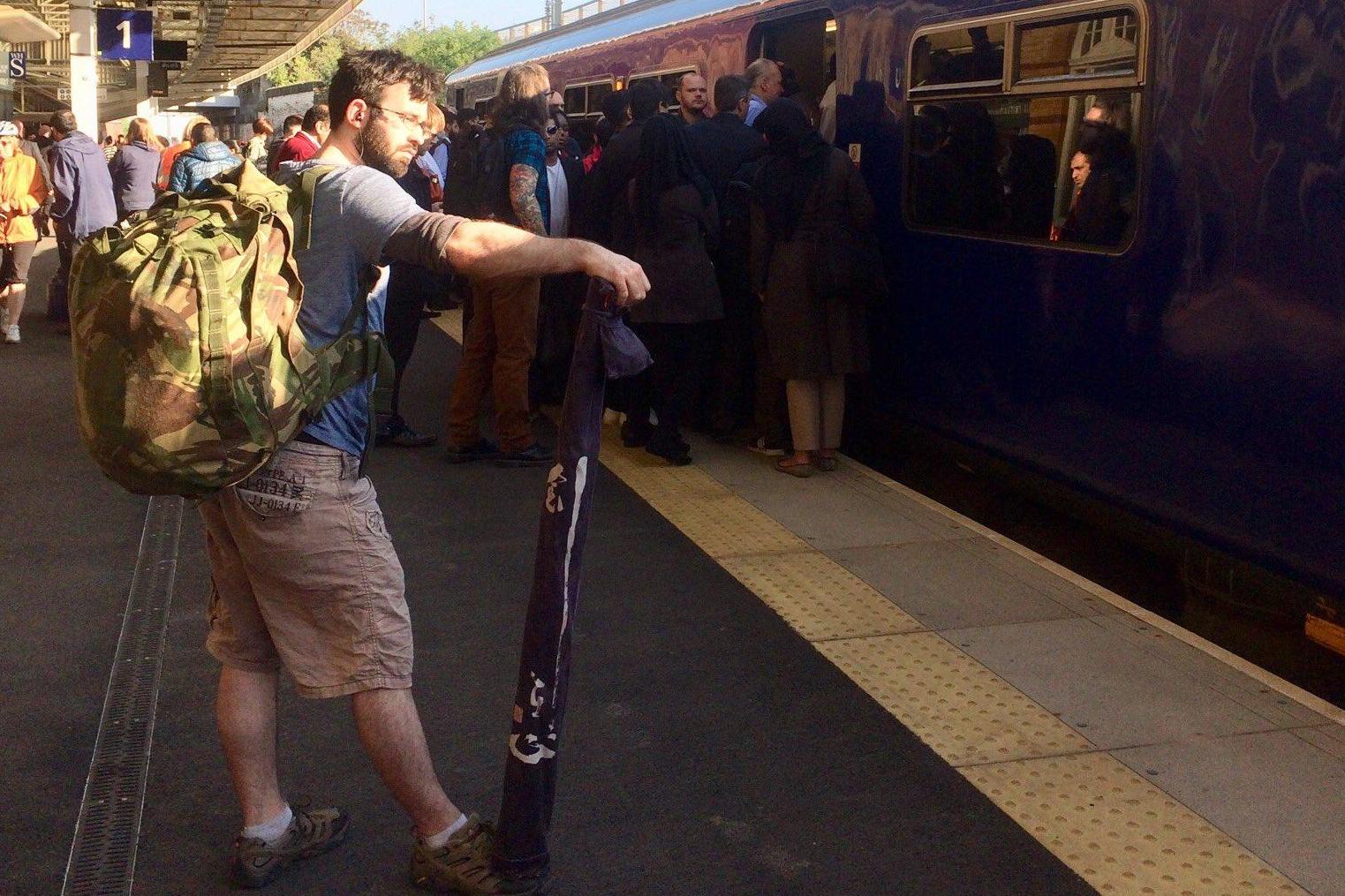 Standing room? Passengers at Bolton station trying to crowd aboard a rush-hour train