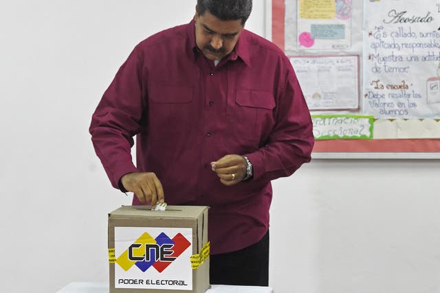 Venezuelan President Nicolas Maduro casts his vote during the presidential elections in Caracas. Maduro was seeking a second term in power.