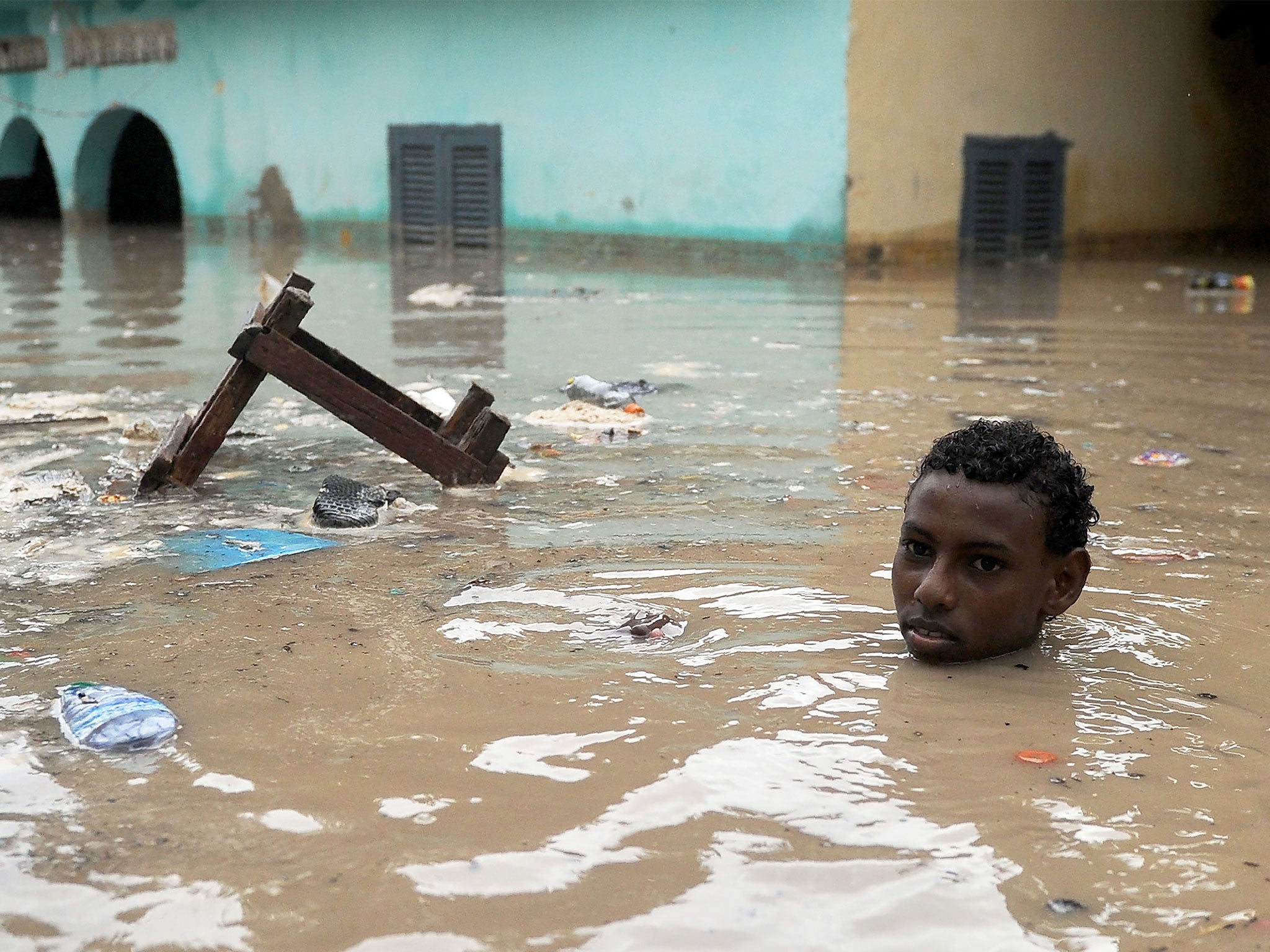 A young in deep floodwater in Mogadishu