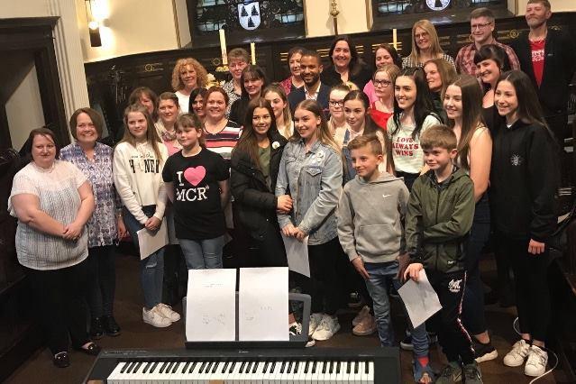 'Trees of Hope' memorial trees line the street to St Ann's Square, Manchester