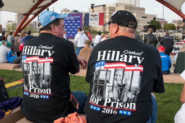 Supporters of then-presidential candidate Donald Trump chanted 'Lock her up' at a rally in Cedar Rapids, Iowa on 28 October 2016.