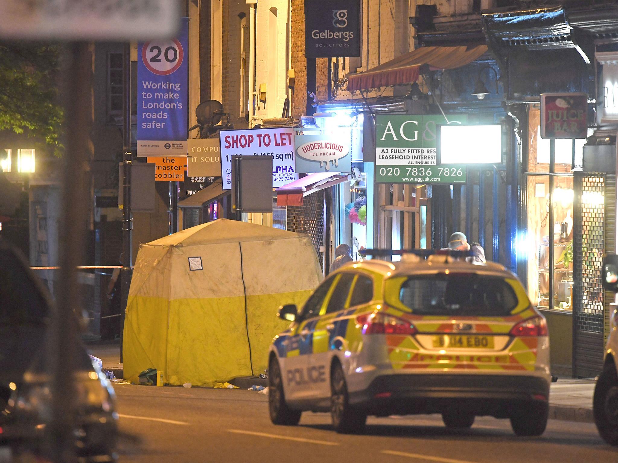 Police officers at the scene of the fatal stabbing in Upper Street