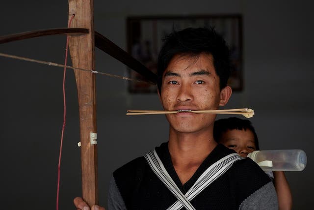 Secret weapons: Zhang and other tribe members are aiming to save the tradition, which dates back to 200BC, by promoting it as a sport