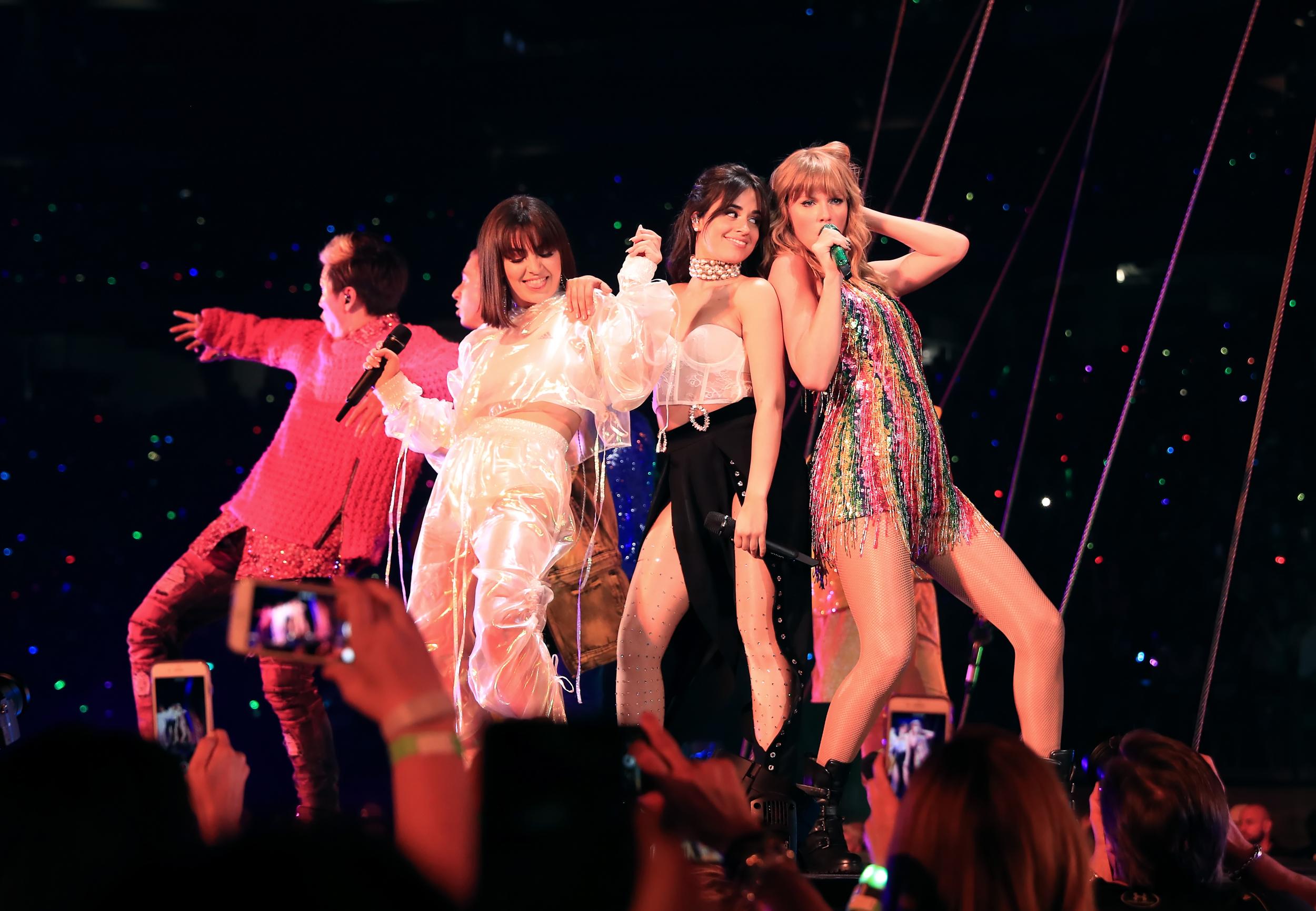Left-right: Charli XCX, Camila Cabello and Taylor Swift perform on the opening night of her 'Reputation' world tour