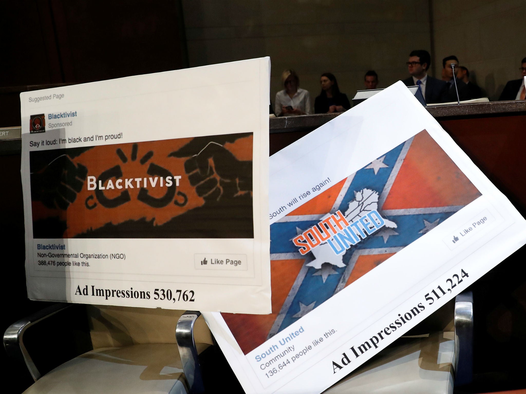 Examples of Russian-linked Facebook pages are seen during a congressional hearing on social media and election interference