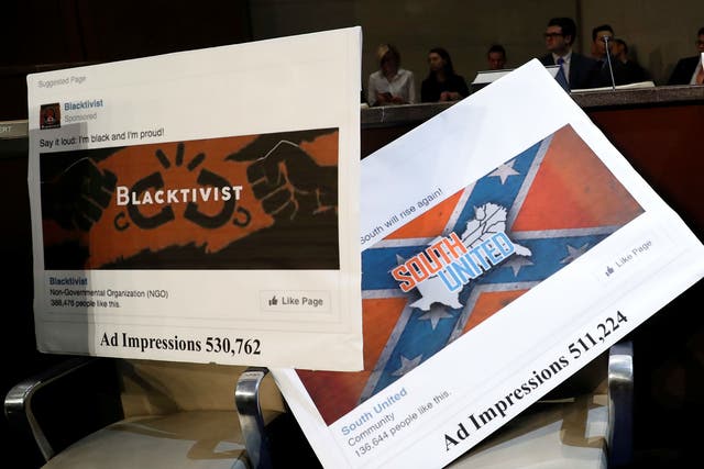 Examples of Russian-linked Facebook pages are seen during a congressional hearing on social media and election interference