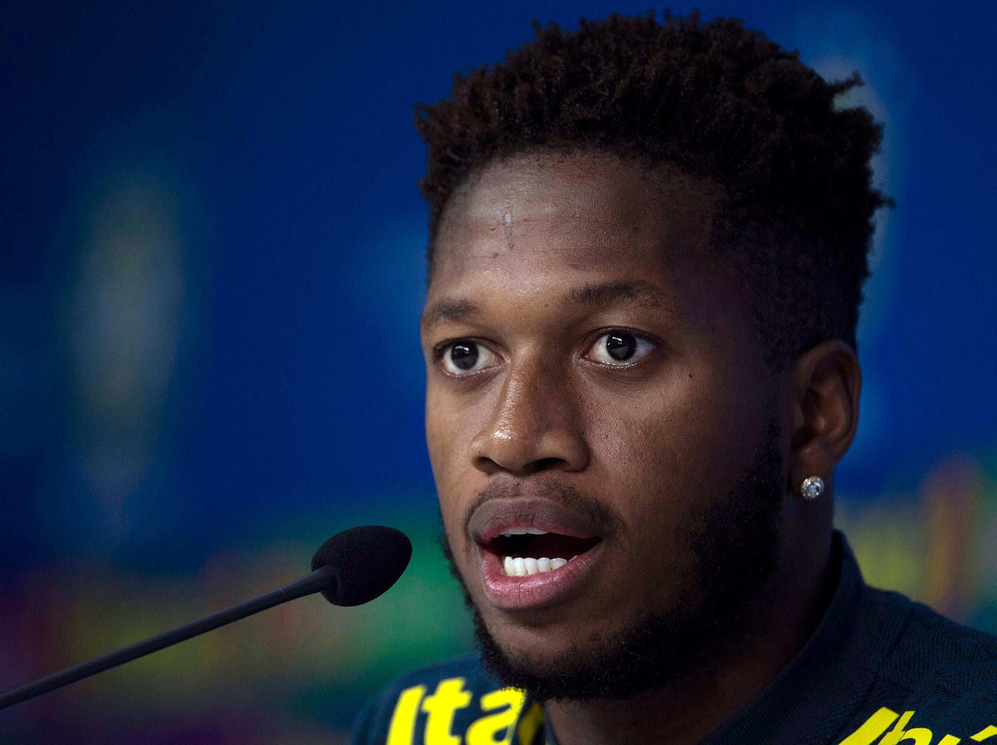 Fred speaks to the media at Brazil's training camp