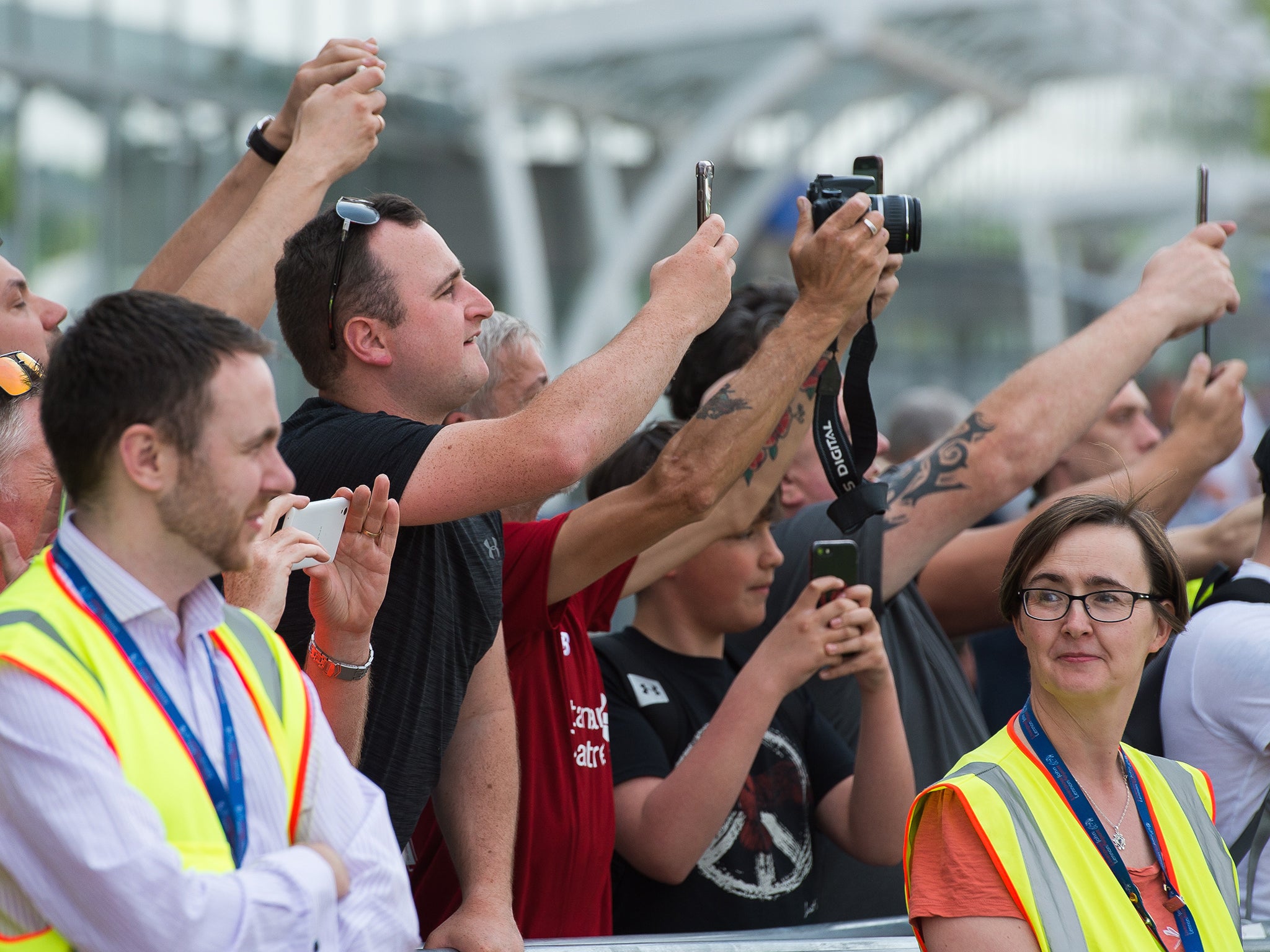 The Liverpool squad arrived on Thursday, prompting fans to try and snap pictures of them outside their hotel (Getty)