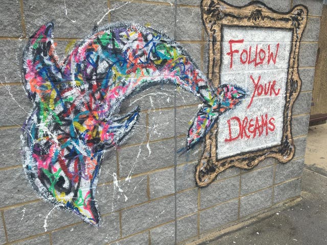 Dream trip: A dolphin adorning a wall on the seafront at Bournemouth