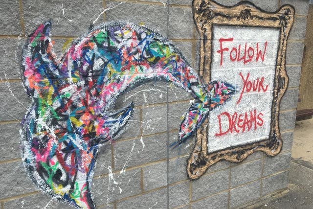 Dream trip: A dolphin adorning a wall on the seafront at Bournemouth