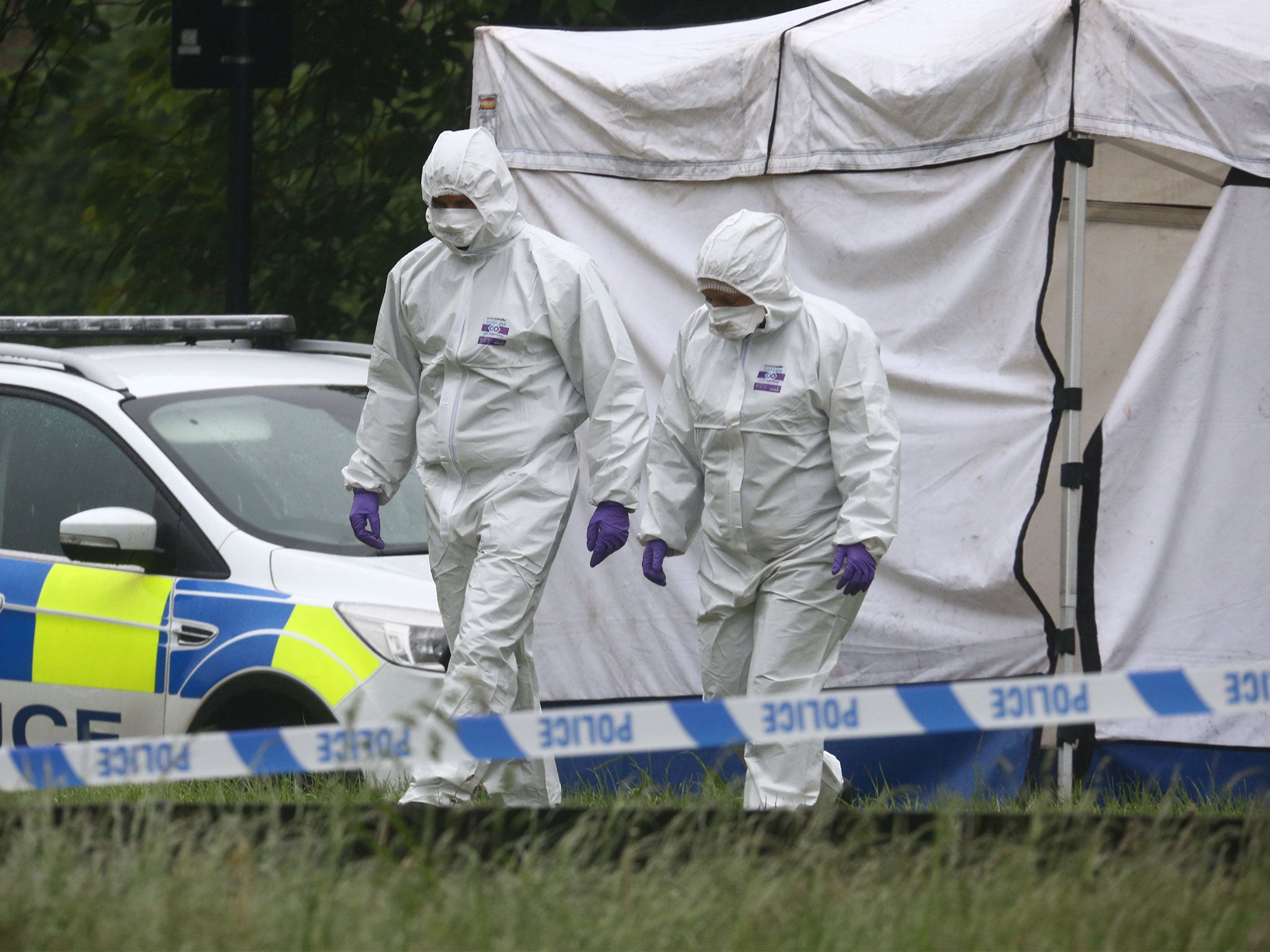 Forensics officers conducting investigations at the scene of the killing on Friday