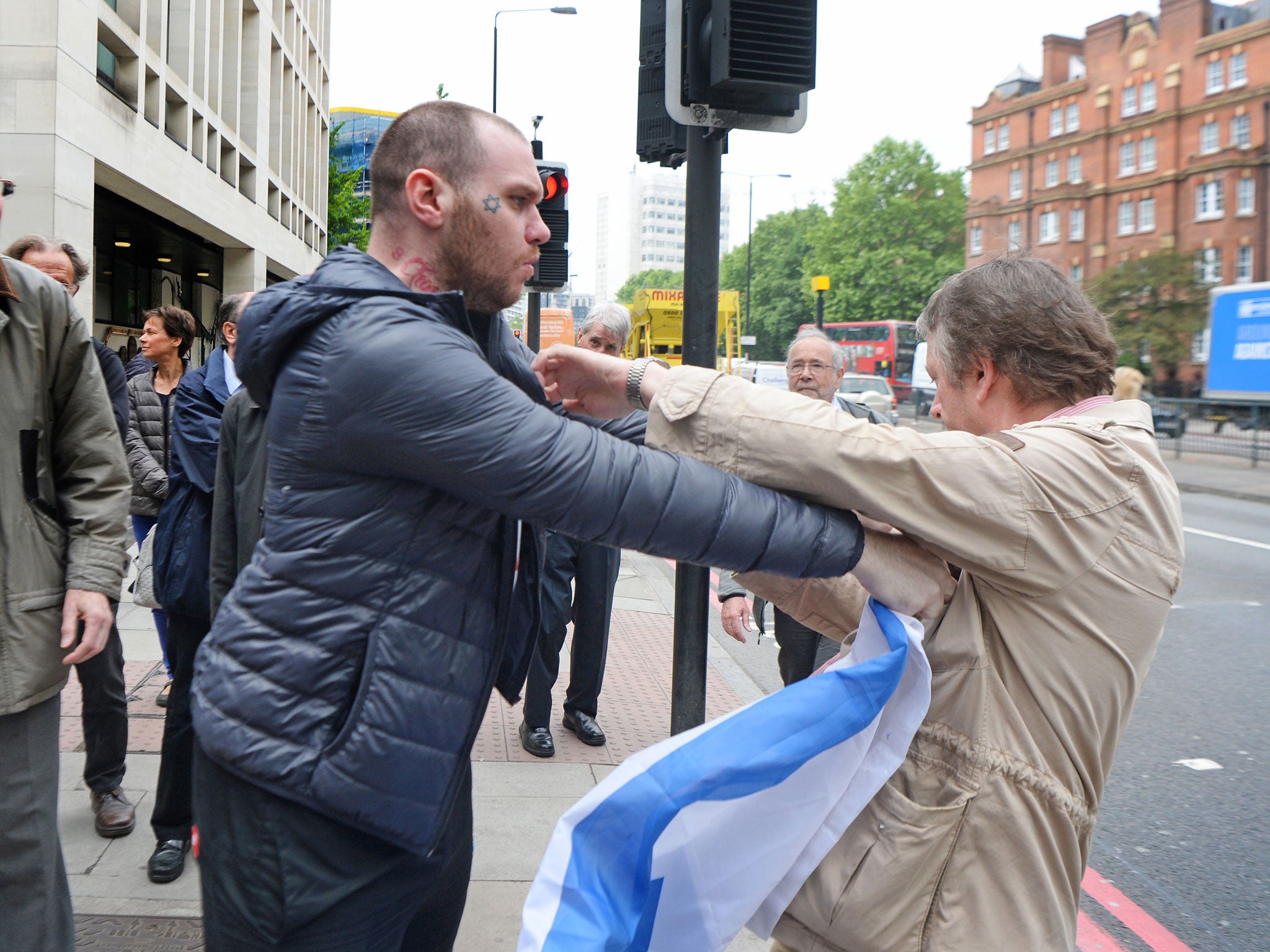 A scuffle outside Westminster Magistrates' Court, where Alison Chabloz was found guilty of posting antisemitic songs online