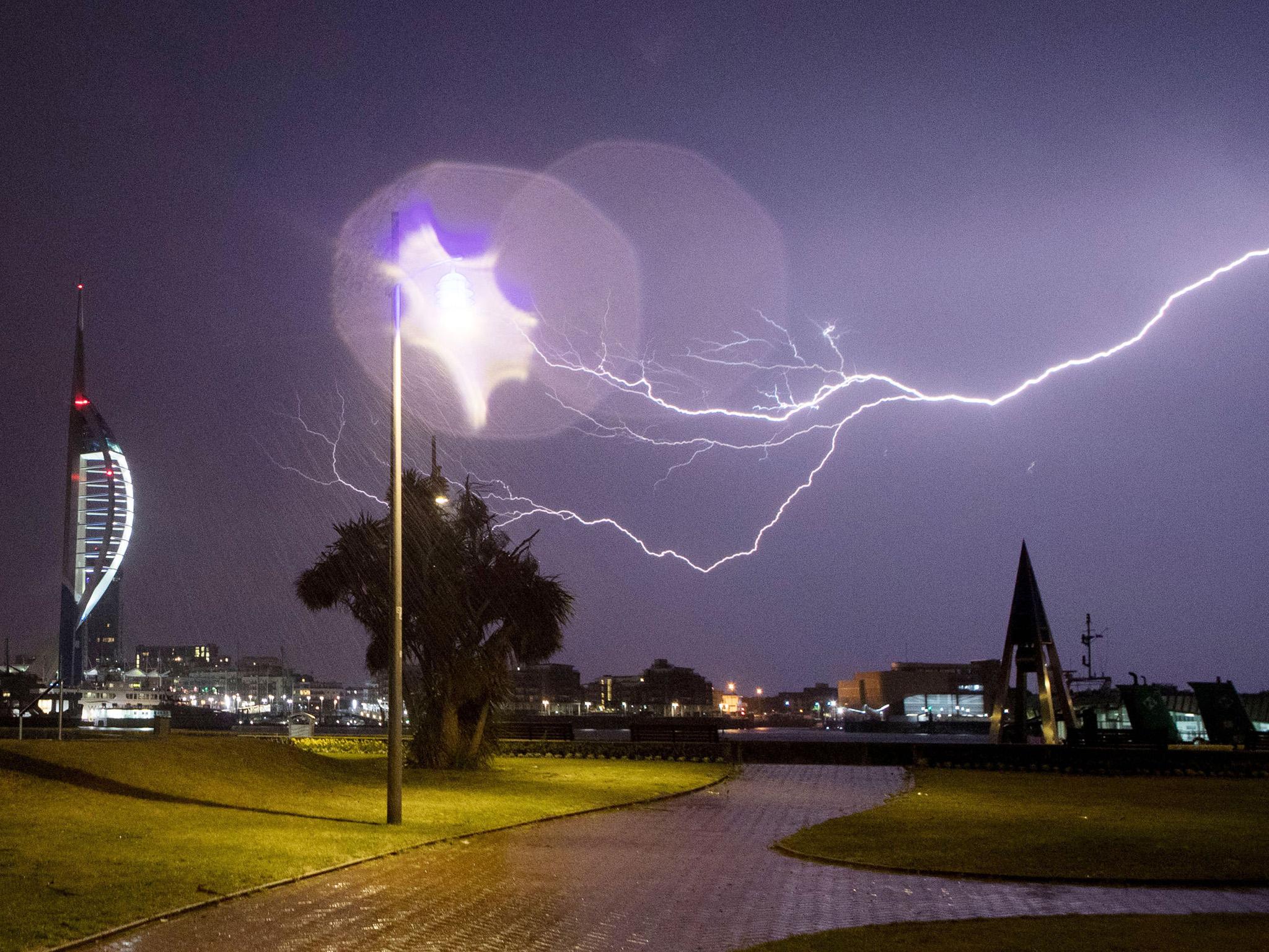Lightning flashes near the Spinnaker Tower in Portsmouth