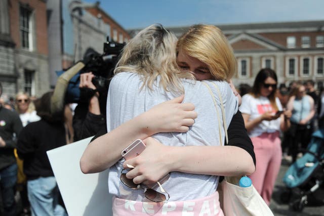 Two women embrace ahead of the official result announcement in Dublin