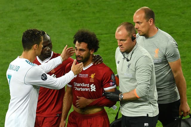 Cristiano Ronaldo consoles Mo Salah as he is substituted with injury