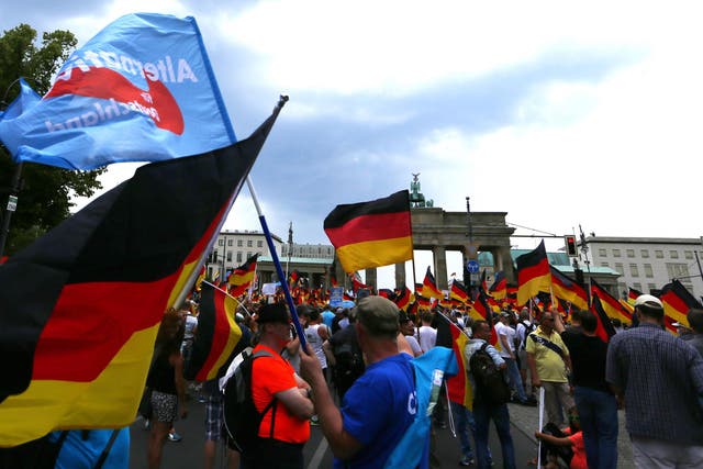 AfD supporters decrying German Chancellor Angela Merkel