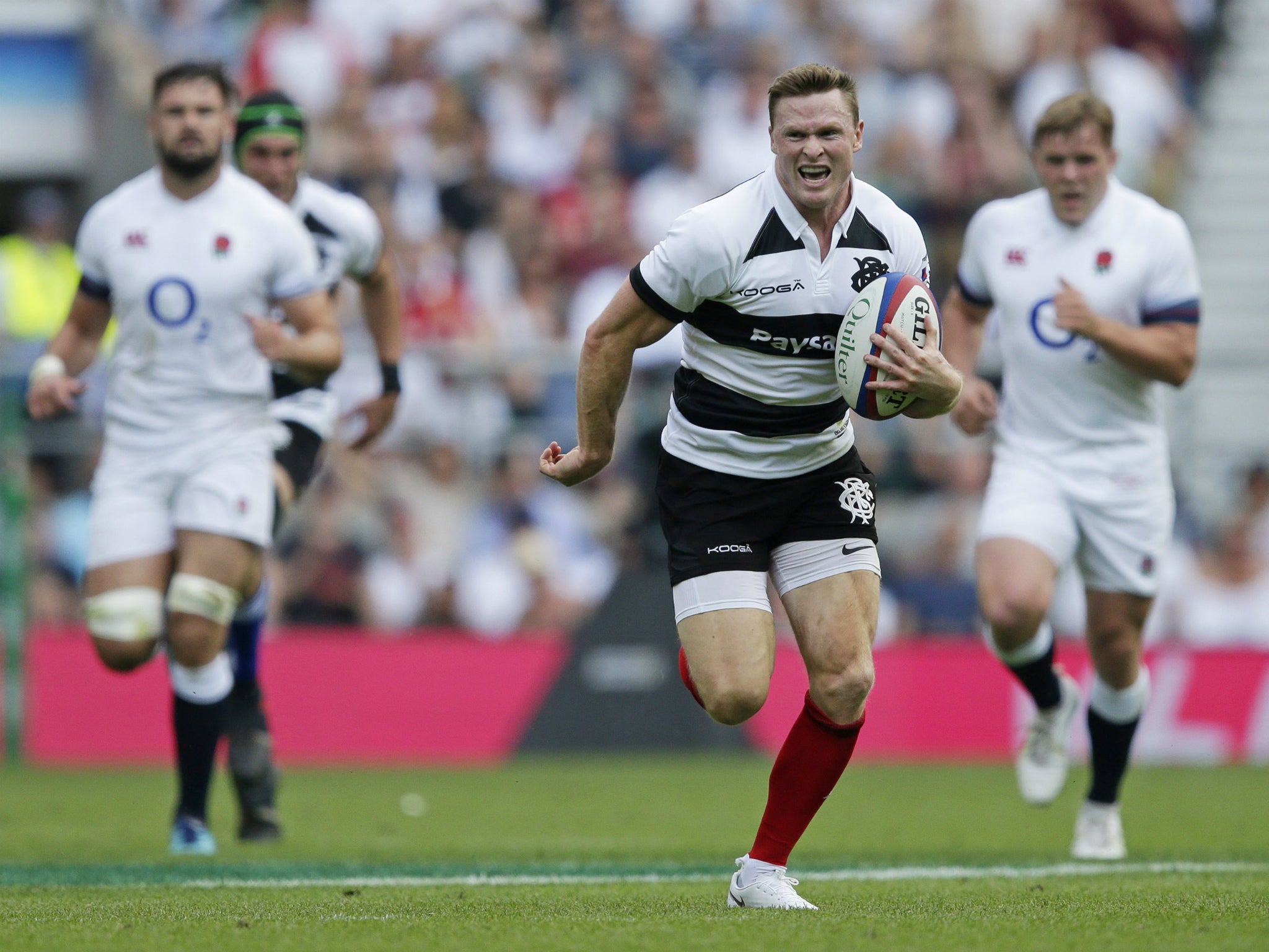Chris Ashton scored three tries as England suffered a record defeat by the Barbarians