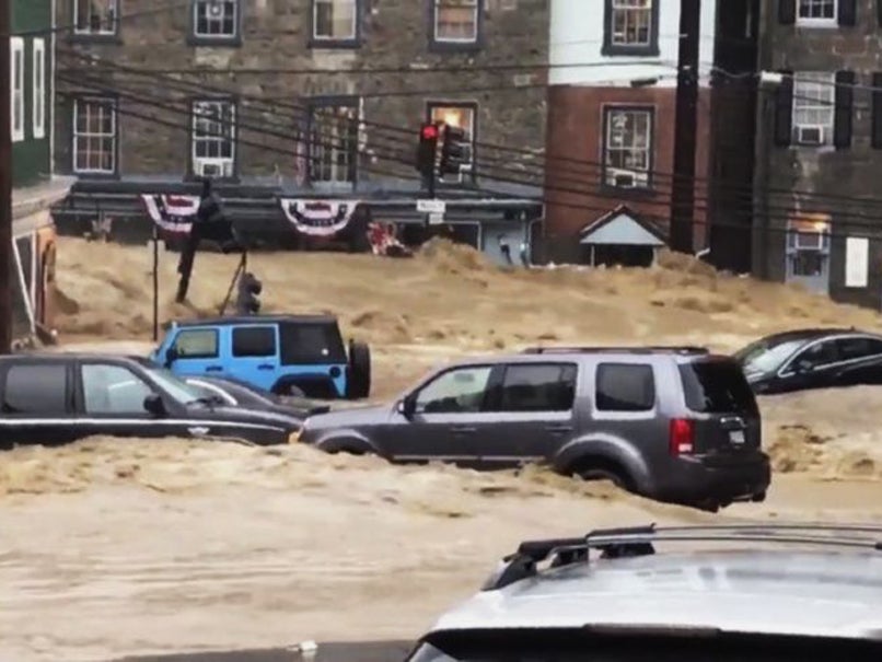 Water rushes through Main Street in Ellicott City, Maryland, following severe rains