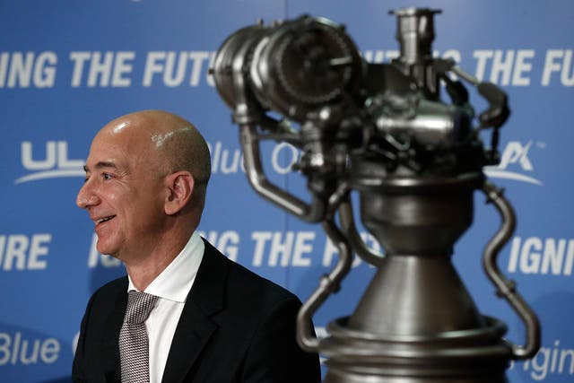 Jeff Bezos, the founder of Blue Origin and Amazon.com, appears at a press conference to announce the new BE-4 rocket engine with Tory Bruno, CEO of United Launch Alliance, at the National Press Club September 17, 2014 in Washington, DC