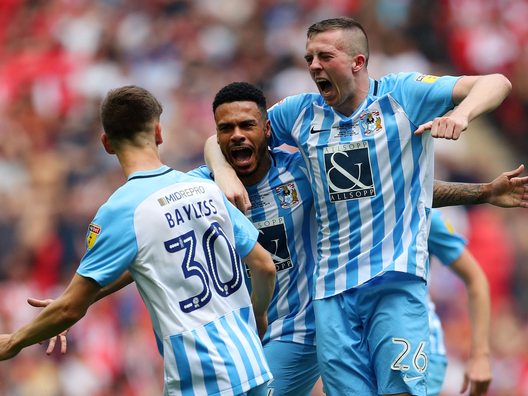 Jordan Willis celebrates with his Coventry team mates after scoring his side's first goal