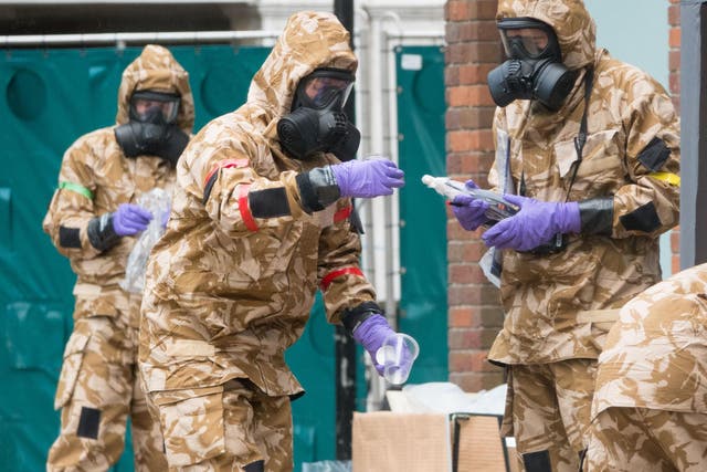 Members of the military work in the Maltings shopping area, close to the bench where Russian former double agent Sergei Skripal and his daughter Yulia were found collapsed