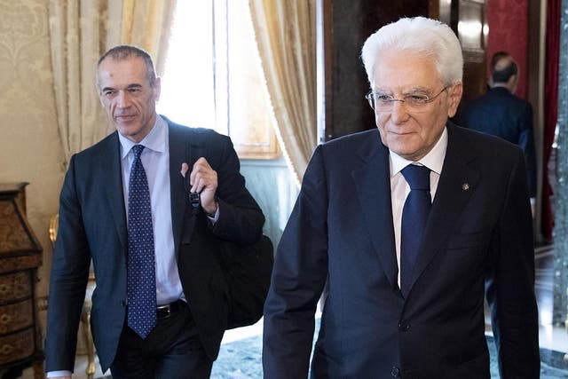 Italy's prime minister-designate, Carlo Cottarelli, meets with the country's president, Sergio Mattarella
