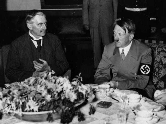 British prime minister Neville Chamberlain at dinner with Adolf Hitler during Chamberlain's 1938 appeasement visit to Munich