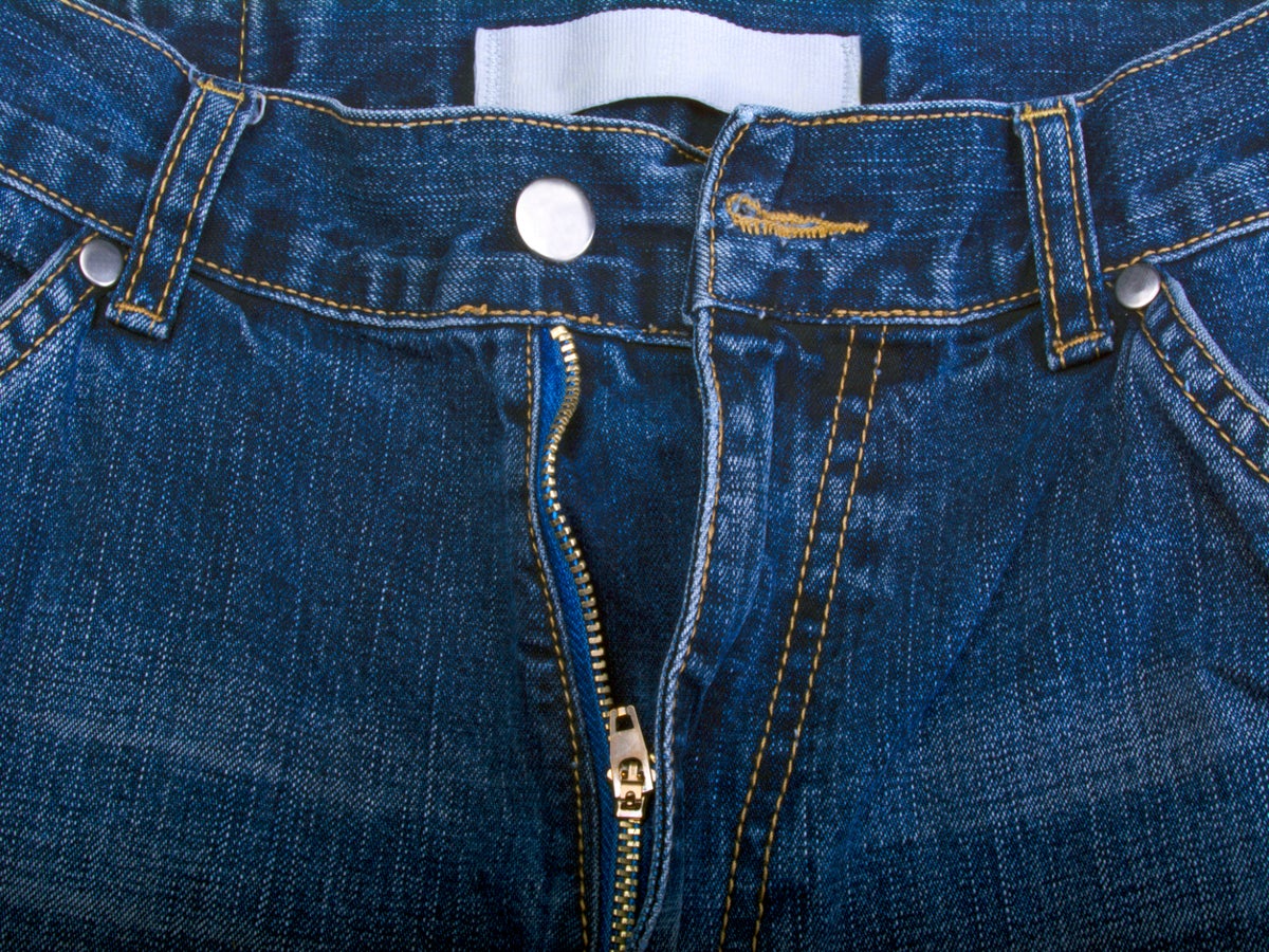Close Up Of Denim Jeans Zip Partly Open Stock Photo, Picture and