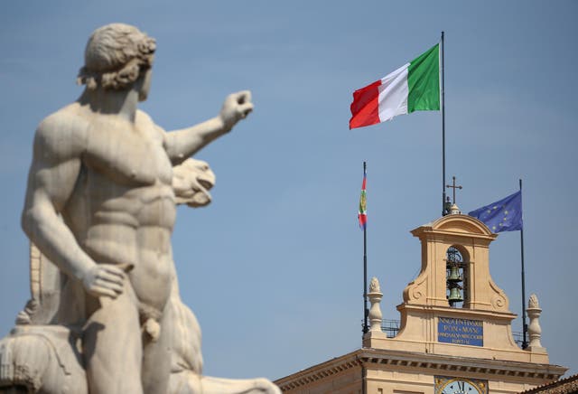 The Italian flag waves over the Quirinal Palace in Rome, an official residence of the Italian president