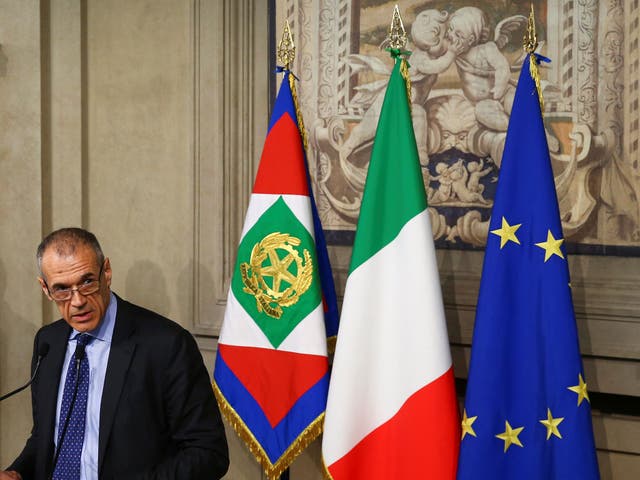 Former senior International Monetary Fund official Carlo Cottarelli speaks after a meeting with Italy's President Sergio Mattarella at the Quirinal Palace in Rome