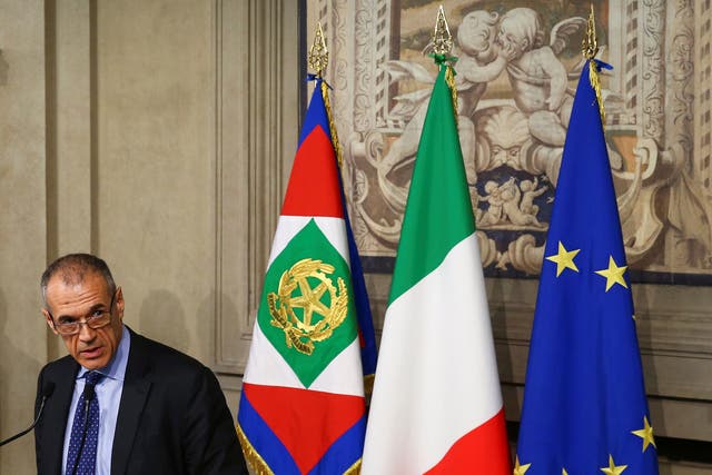 Former senior International Monetary Fund official Carlo Cottarelli speaks after a meeting with Italy's President Sergio Mattarella at the Quirinal Palace in Rome