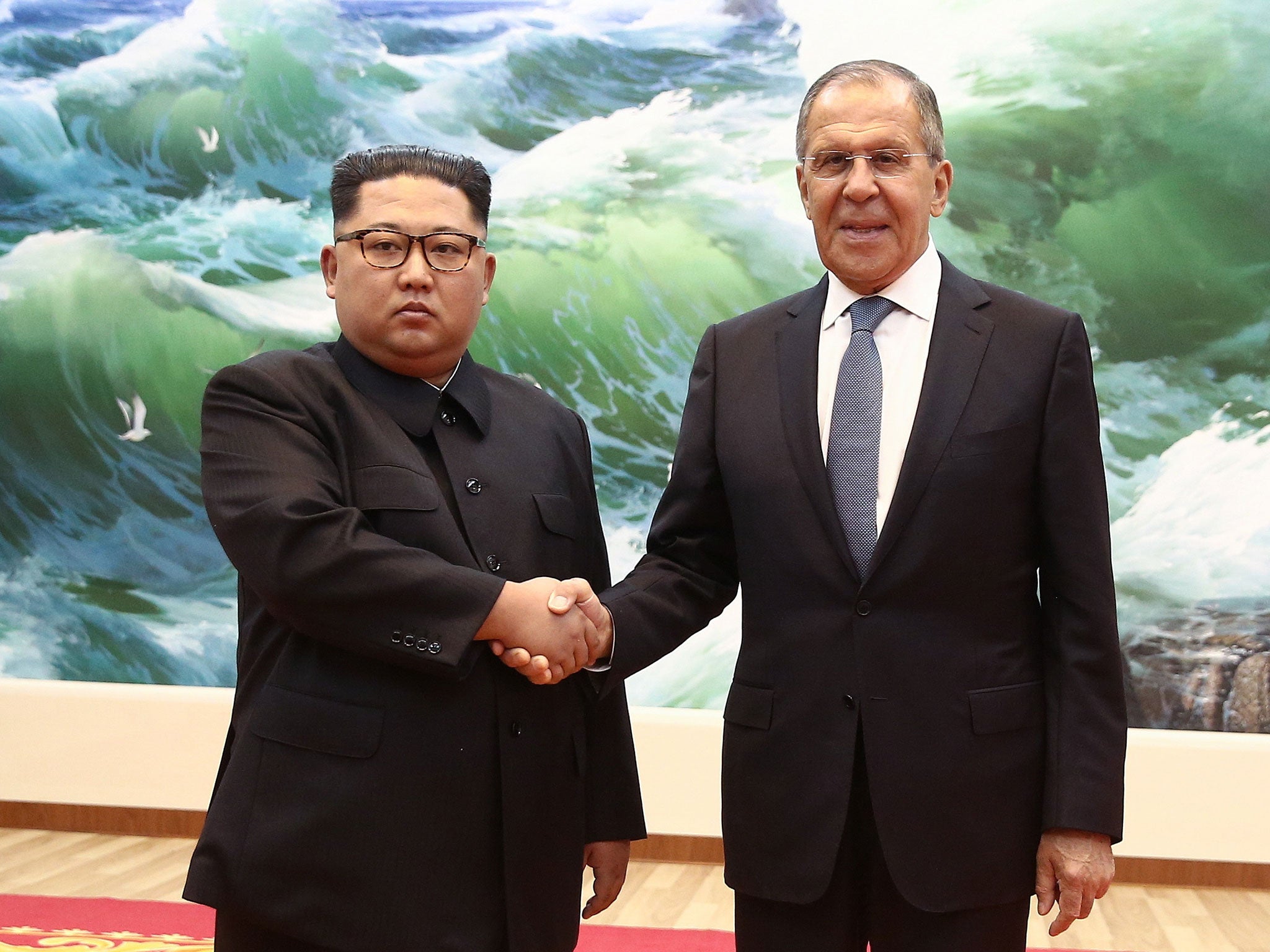 North Korea's leader, Kim Jong-un, shakes hands with Russia's foreign minister, Sergei Lavrov, as he visits Pyongyang for an official visit