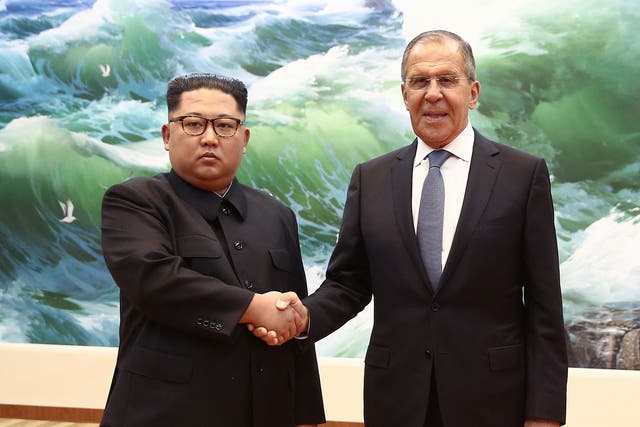 North Korea's leader, Kim Jong-un, shakes hands with Russia's foreign minister, Sergei Lavrov, as he visits Pyongyang for an official visit