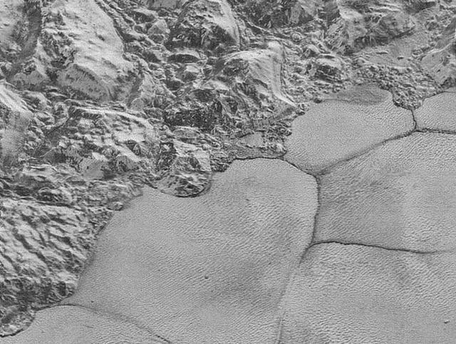 Methane dunes at the bottom of a major mountain range on Pluto