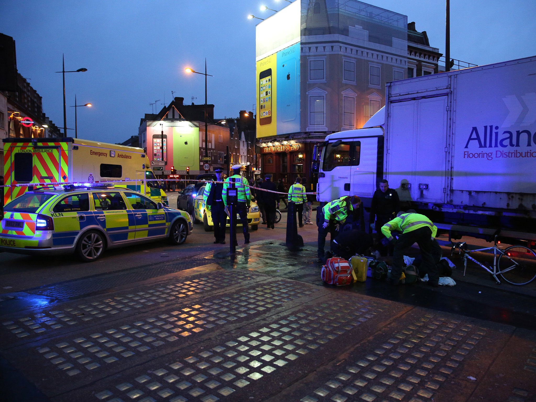 A cyclist receives emergency medical treatment after being involved in an accident with a lorry in Camden in 2013