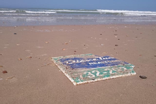 The sign washed up nearly 4,000 miles away from New Jersey