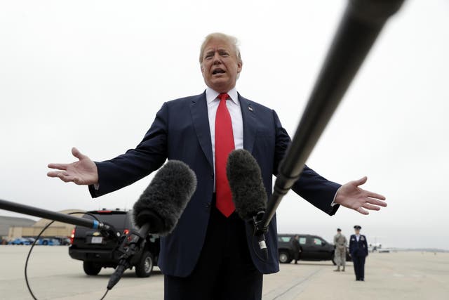 President Donald Trump speaks to the media before boarding Air Force One for a trip to Texas to meet with families of the Santa Fe school shooting victims