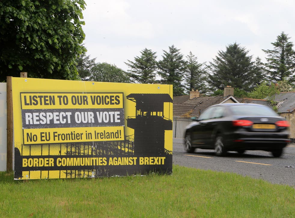 Traffic passes anti-Brexit signs on the County Derry/Londonderry Northern Ireland and County Donegal in the Irish Republic. Northern Ireland could be given joint EU and UK status and a 'buffer zone' on its border with the Republic, under new plans being drawn up by David Davis, according to reports.