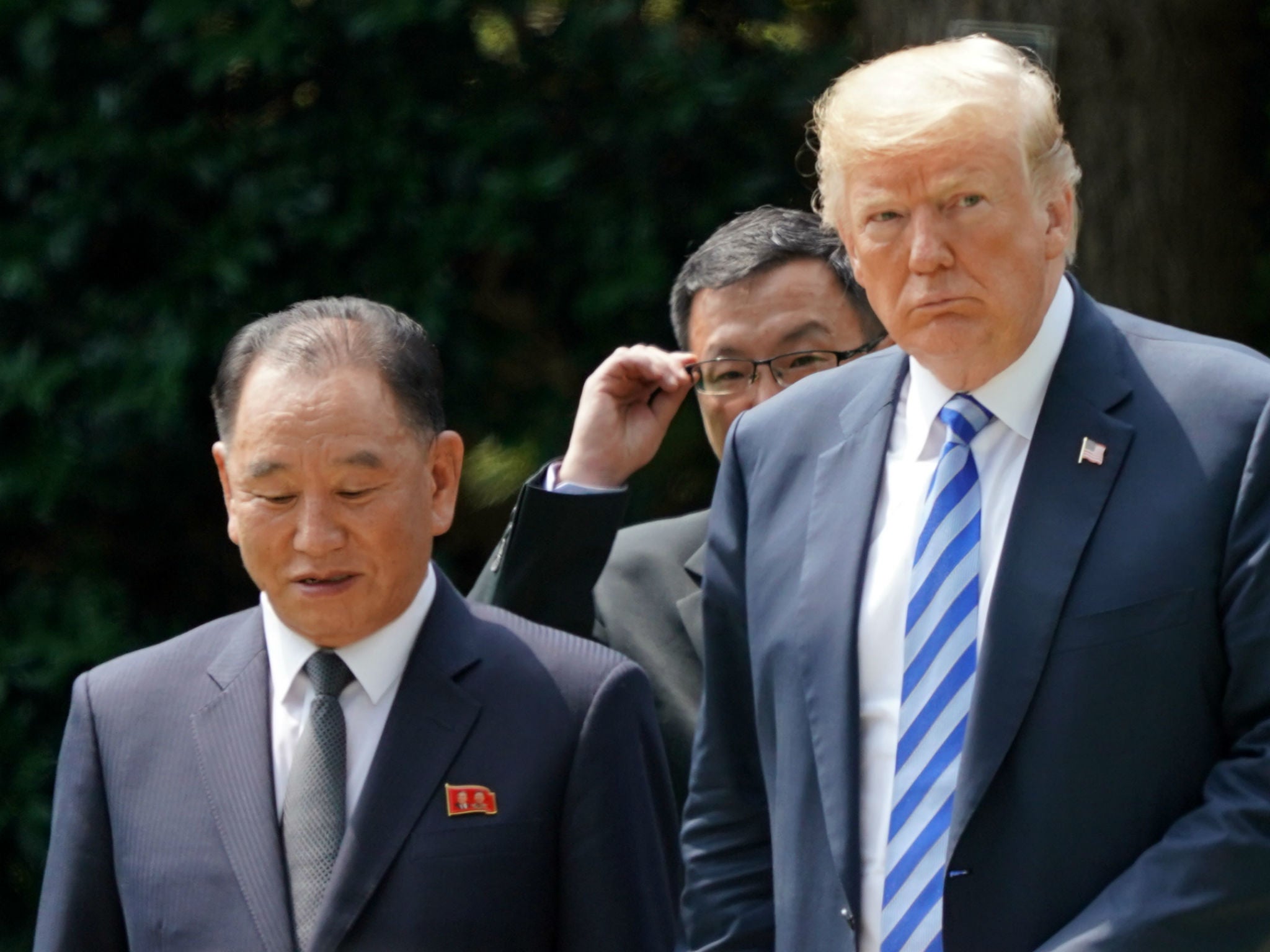 President Donald Trump walks with Kim Yong Chol, left, former North Korean military intelligence chief and one of leader Kim Jong Un's closest aides