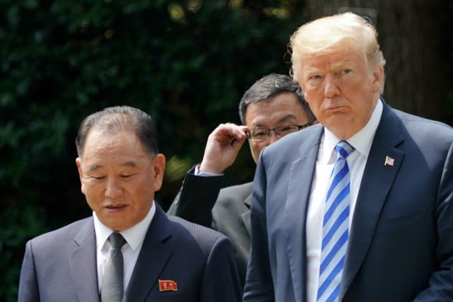 President Donald Trump walks with Kim Yong Chol, left, former North Korean military intelligence chief and one of leader Kim Jong Un's closest aides