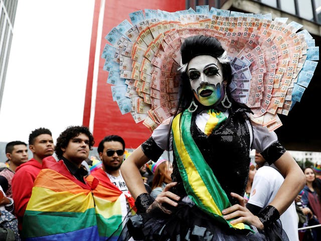 A reveller takes part in a Gay Pride parade along Paulista Avenue in Sao Paulo, Brazil